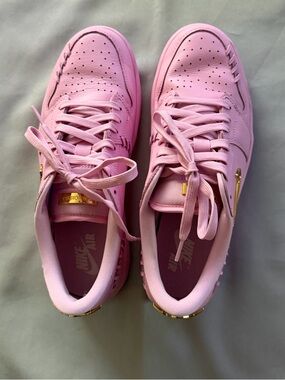 Nike Women’s Air Jordan Low-Top Sneakers in Pastel Pink with Gold Accents